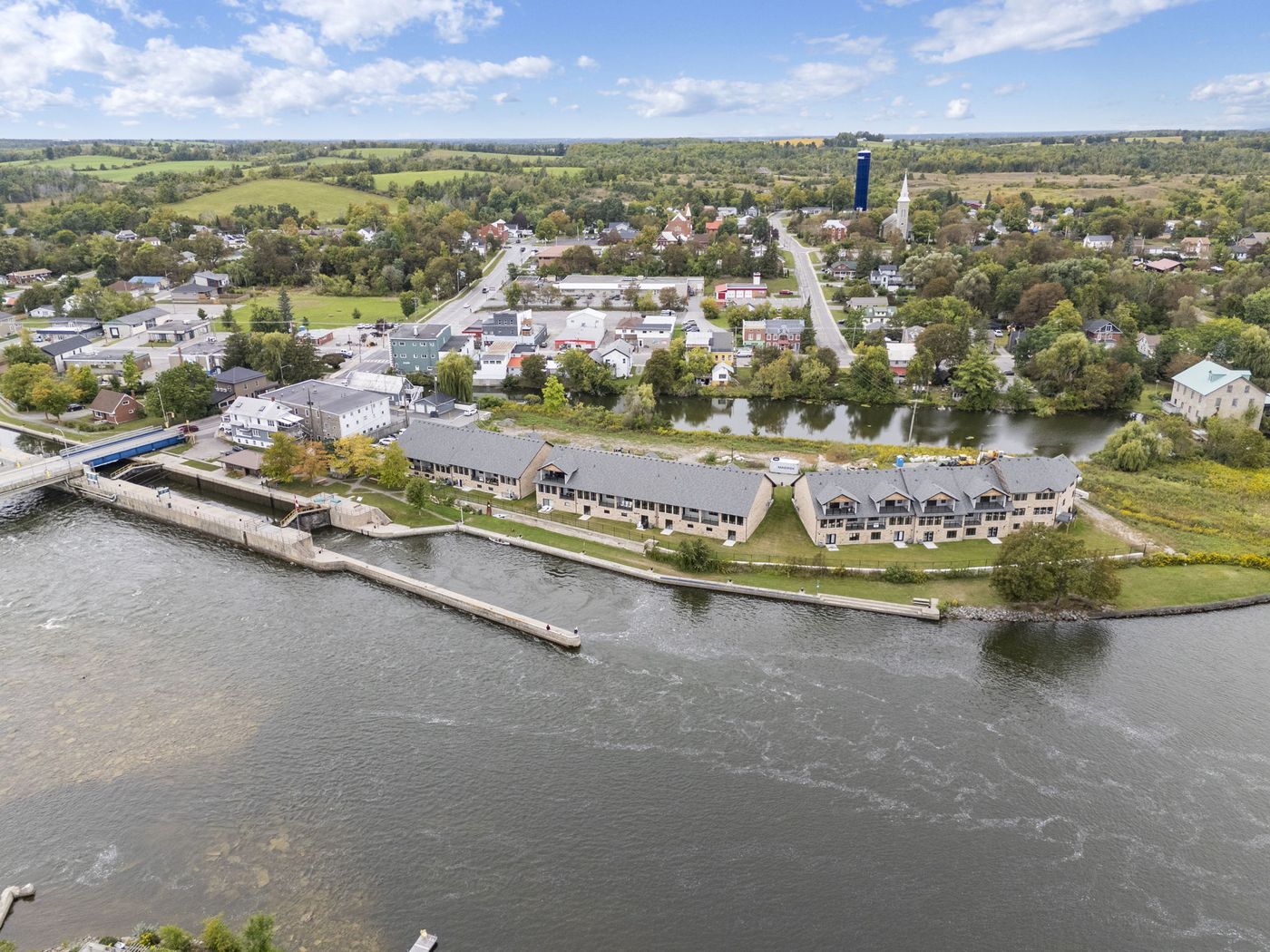 Lock Eighteen townhomes with the village of Hastings beyond