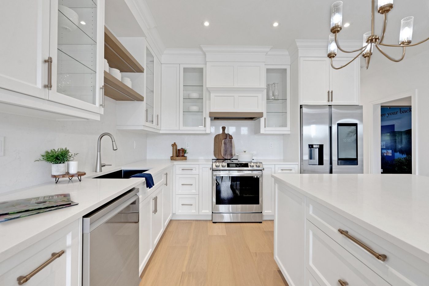 Kitchen with range and custom hood