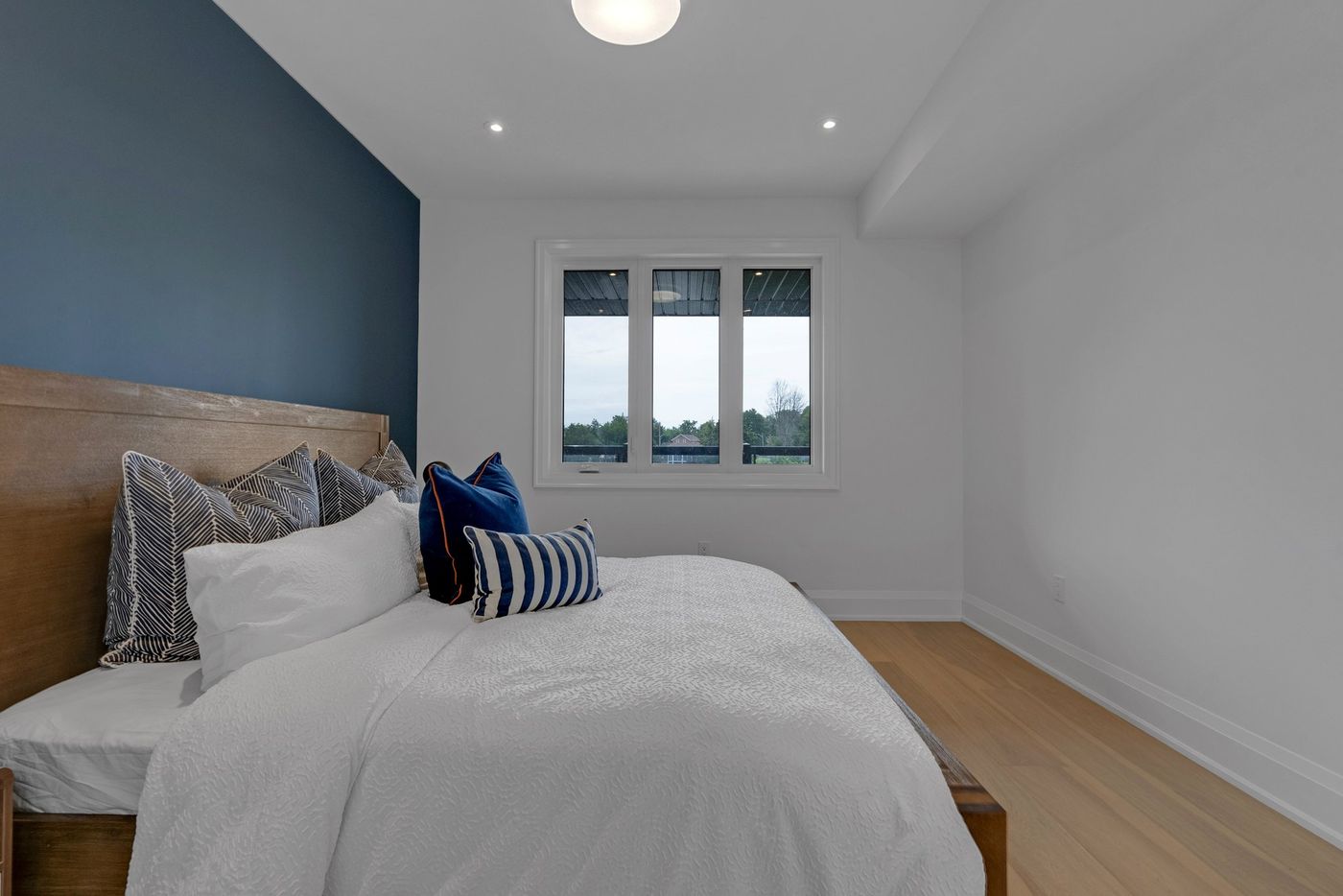 Primary bedroom with window to the covered deck