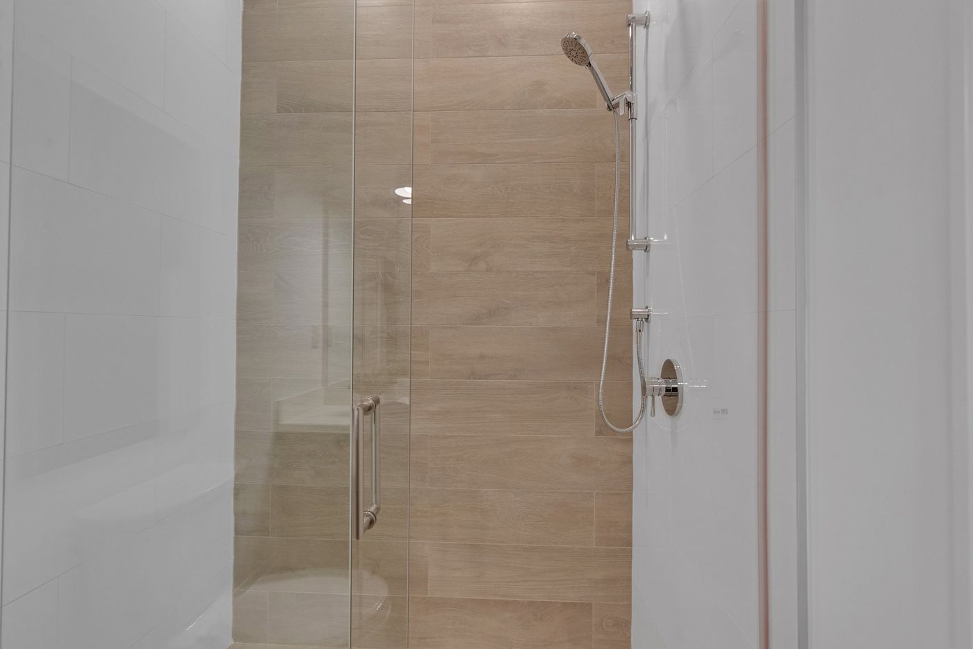 Ensuite glass shower with wood-look tile