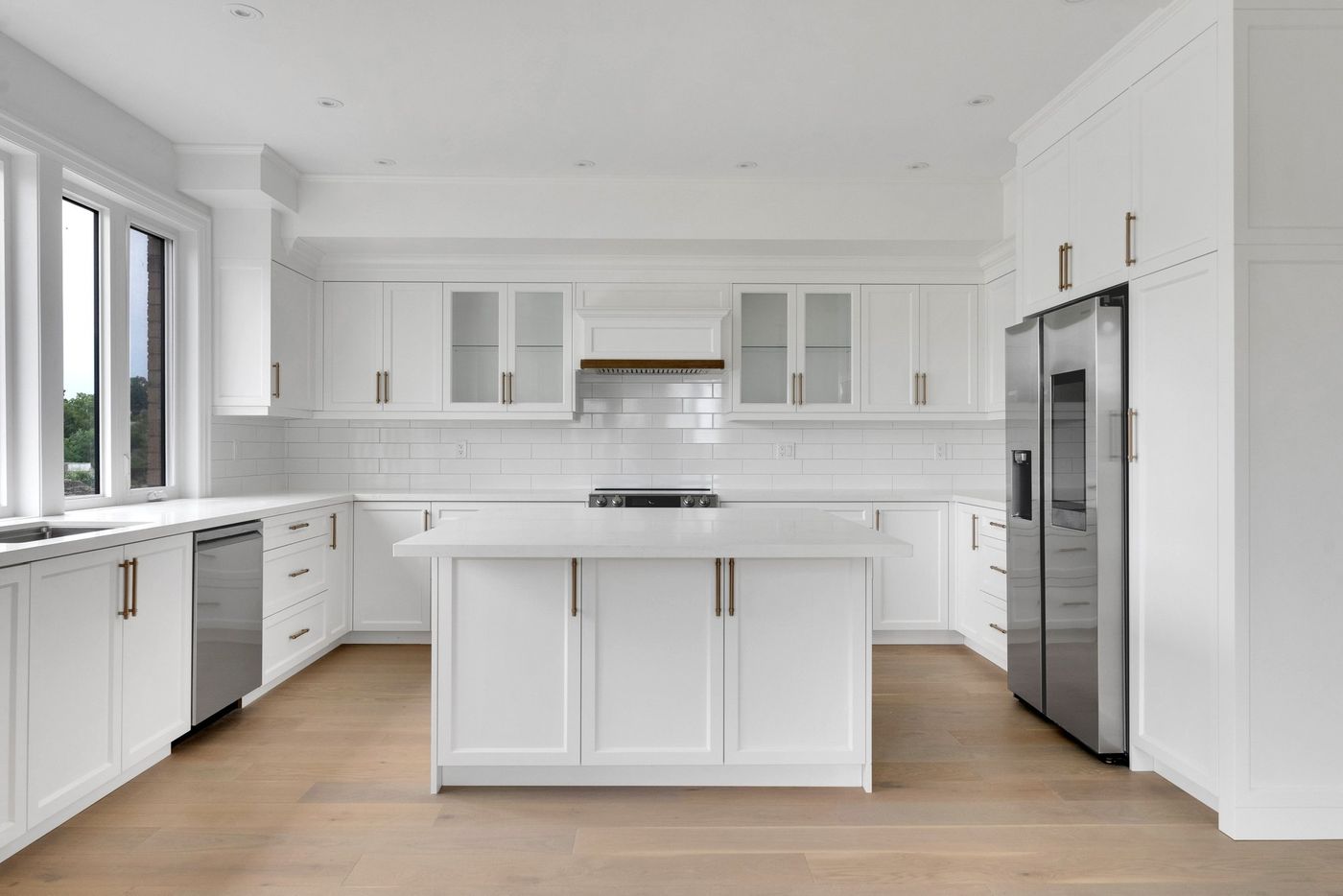 Kitchen island facing the range wall
